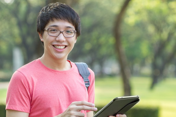 Asian student using tablet
